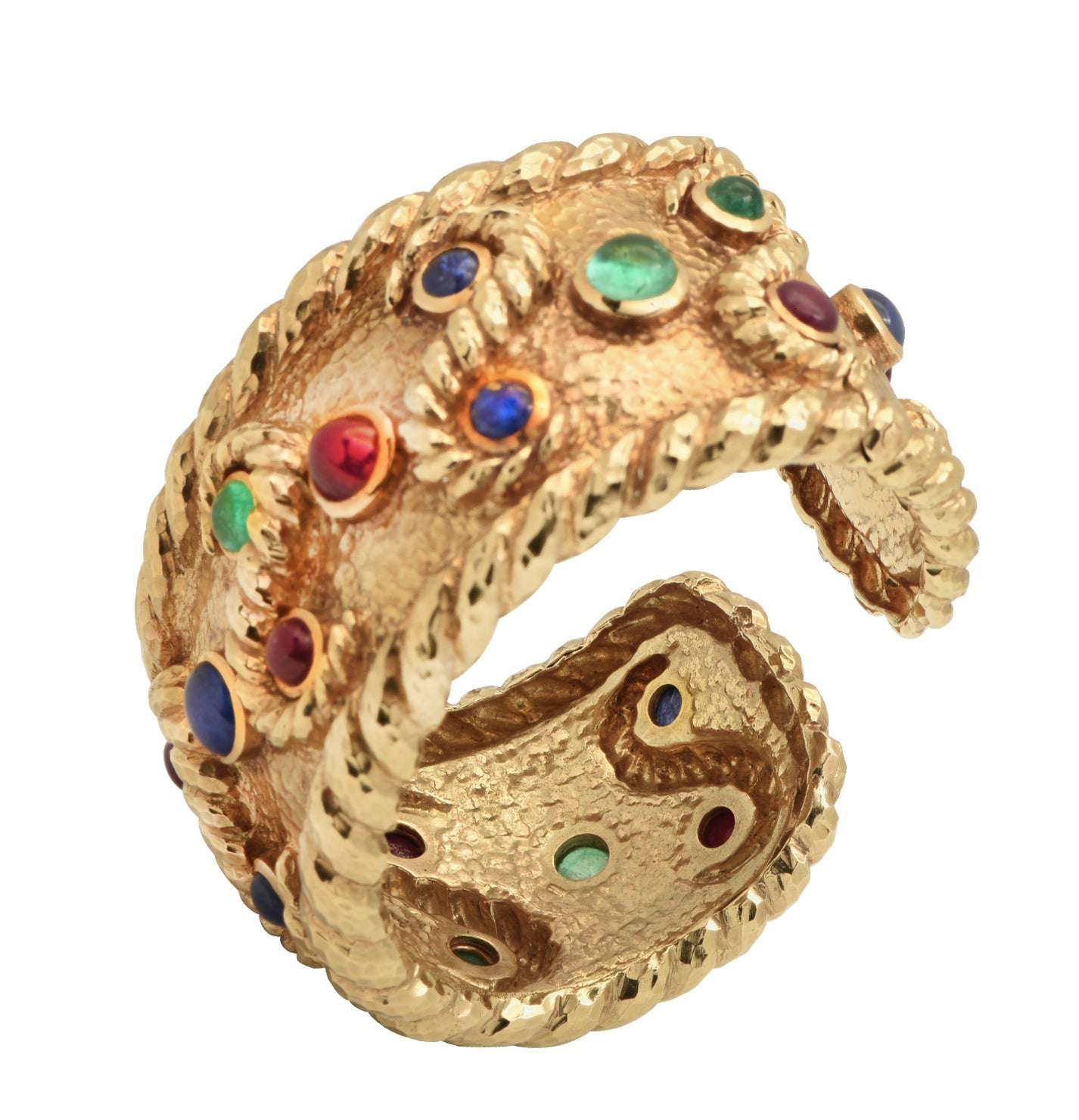David Webb 18K Yellow Gold Cuff Bangle Bracelet featuring 6 Emeralds, 8 Rubies, and 6 Sapphires, elegantly crafted with a unique hammered texture, showcasing vibrant cabochon gemstones by Vivid Diamonds.