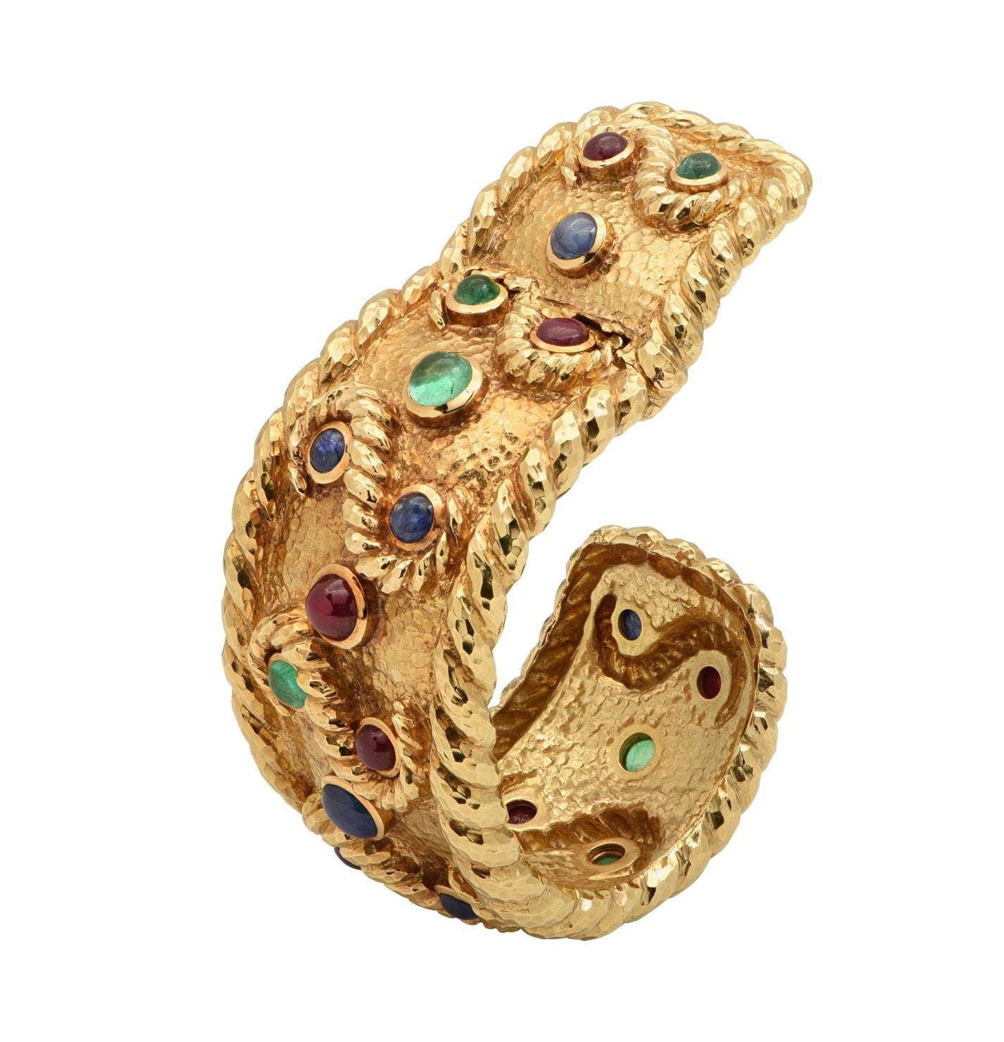 Luxury David Webb 18K Yellow Gold Cuff Bangle Bracelet adorned with 6 Emeralds, 8 Rubies, and 6 Sapphires, highlighting artisanal craftsmanship and a stunning design by Vivid Diamonds.