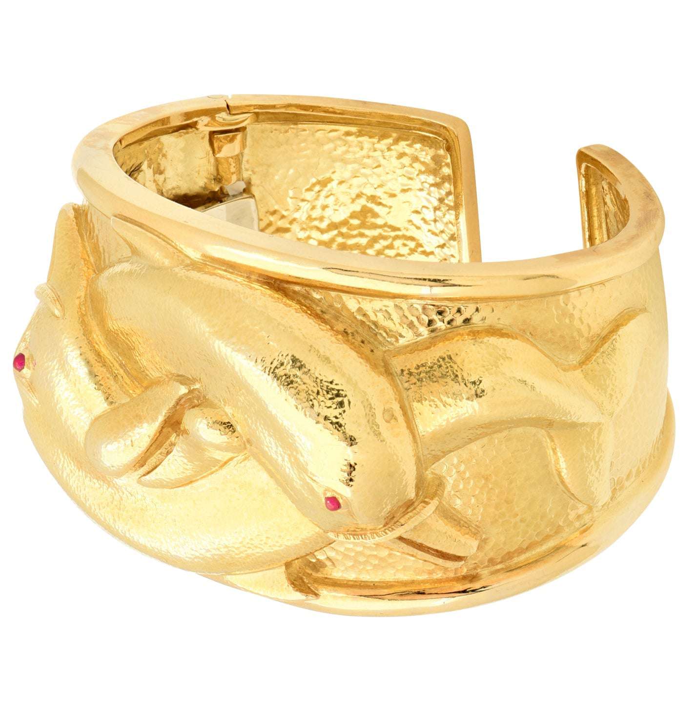 Side view of the David Webb 18K Yellow Gold Dolphin Cuff Bangle, showcasing its exquisite dolphin motifs and vibrant ruby accents, offered by Vivid Diamonds.