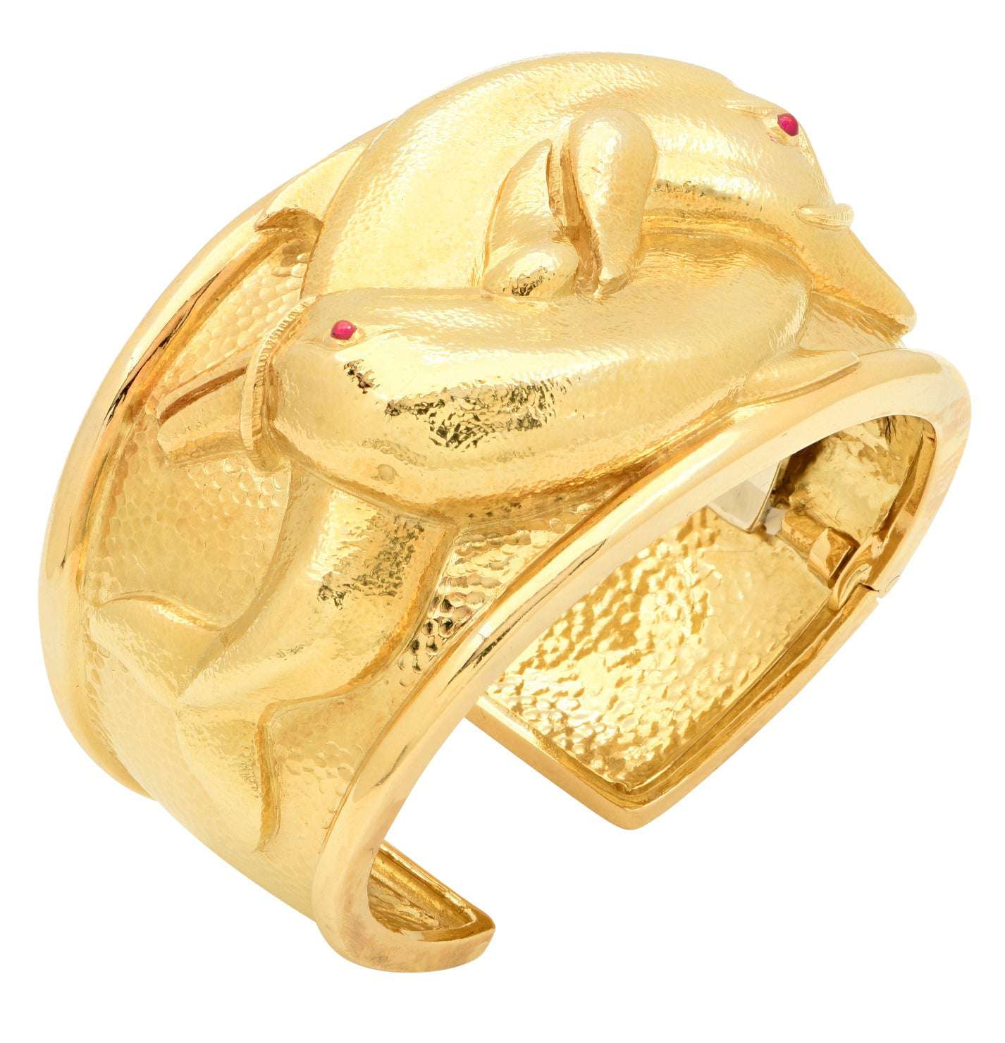 David Webb 18K Yellow Gold Dolphin Cuff Bangle featuring intricately designed dolphins and ruby accents, crafted by Vivid Diamonds, embodying luxury and elegance.