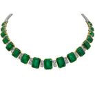 A stunning 103.32 Carat Emerald and Diamond Necklace in Platinum by Vivid Diamonds, featuring a sequence of emerald-cut emeralds and brilliant diamonds, showcasing a luxurious and timeless design.