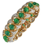 Elegant 50 Carat Emerald and Diamond Bracelet designed by Vivid Diamonds, featuring vibrant cabochon-cut emeralds set in exquisite 18k white and yellow gold, showcasing luxurious craftsmanship and timeless beauty.