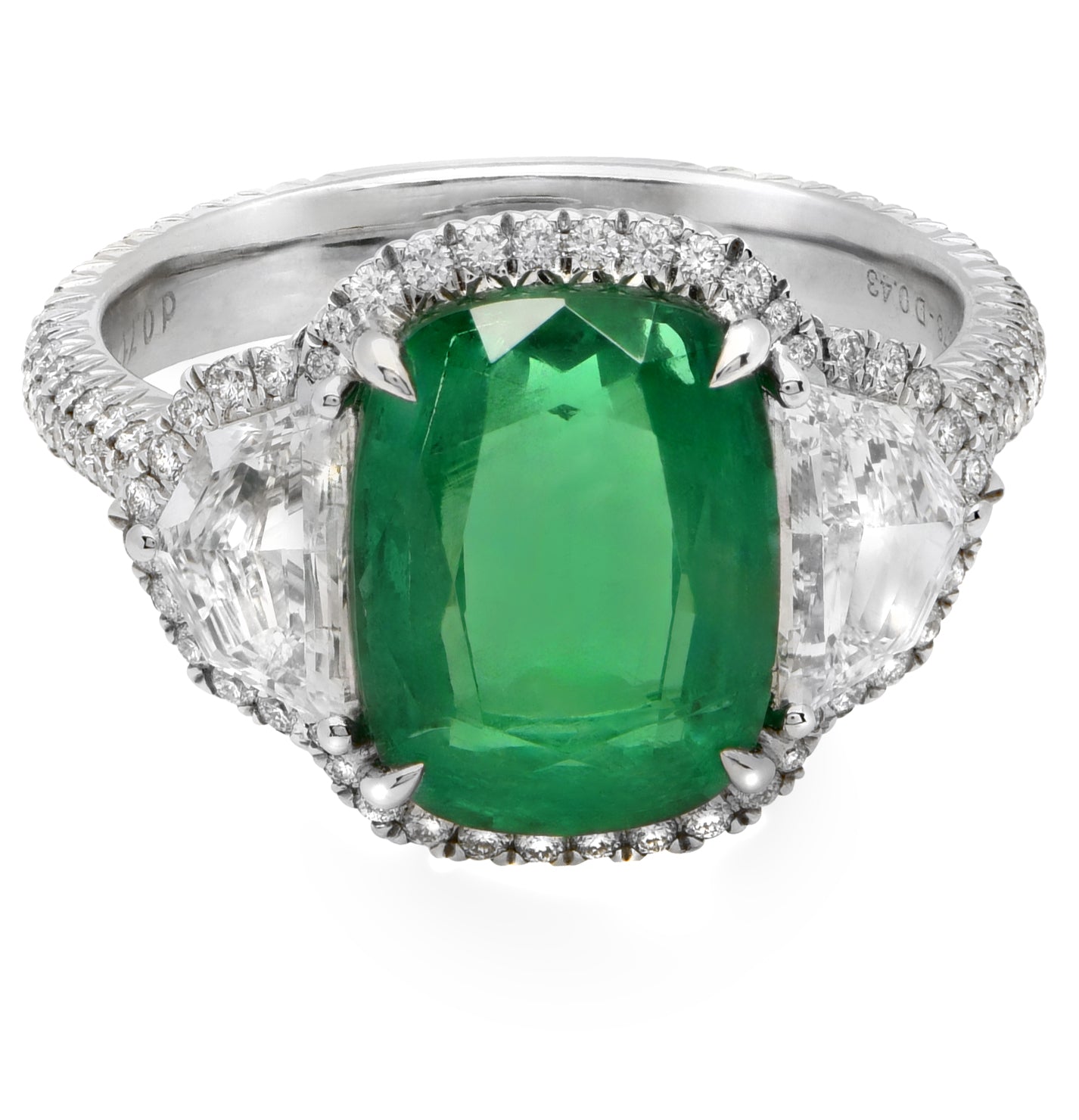 Elegant 4Ct Cushion Cut Emerald & Diamond Halo Ring in Platinum by Vivid Diamonds, featuring a vibrant emerald center stone flanked by trilliant diamonds, highlighting timeless luxury.