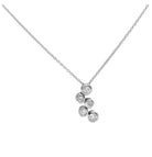 Close-up view of the 14k White Gold Diamond Necklace by Vivid Diamonds, designed with five shimmering round brilliant cut diamonds for understated luxury.