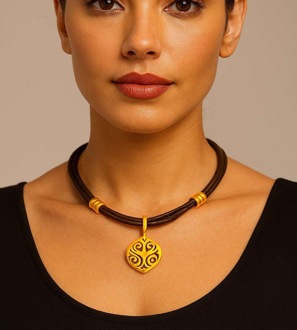 Sophisticated model wearing the 18k Yellow Gold Necklace by Vivid Diamonds, showcasing the beautiful pendant against a minimalist background.