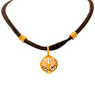 Close-up of the 18k Yellow Gold Necklace by Vivid Diamonds, highlighting the unique swirling pendant design on a rich leather strap.
