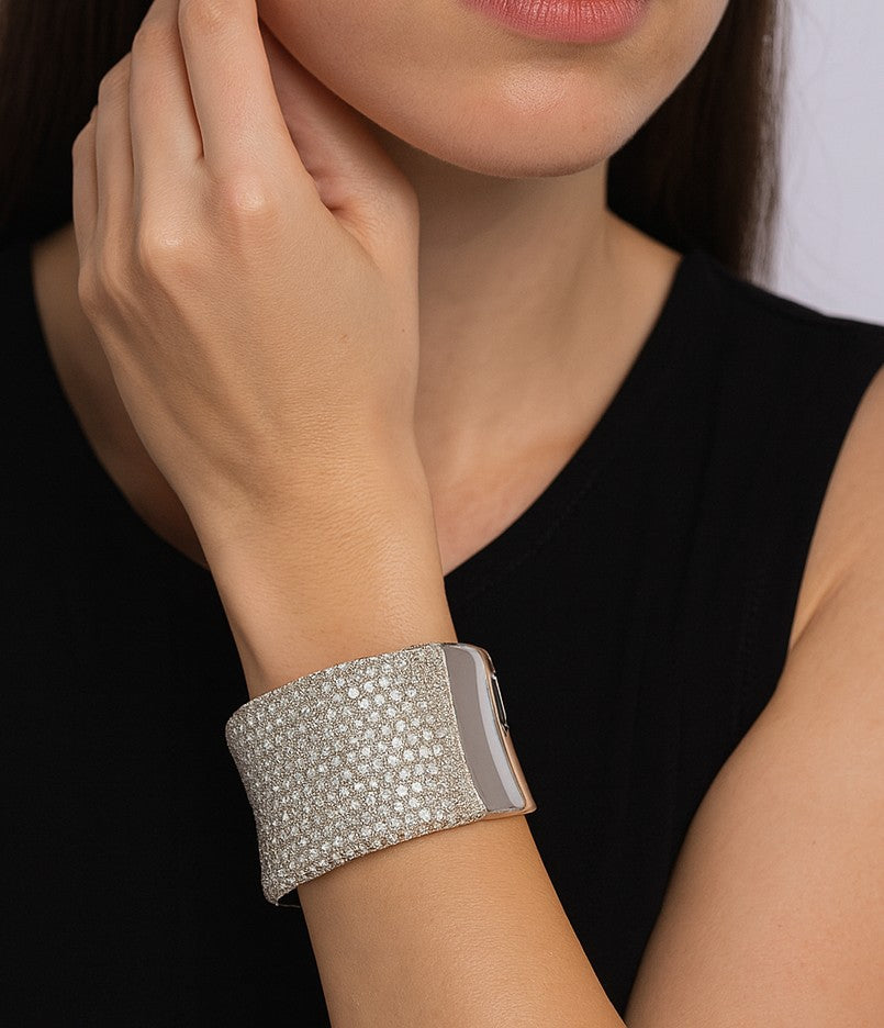 Vivid Diamonds 27.72 Carat Diamond Bangle worn elegantly on a wrist, highlighting the exquisite craftsmanship and luxurious diamond detail for a sophisticated look.