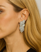 Elegant model wearing Mid-Century 15.15 Diamond Chandelier Earrings by Vivid Diamonds, highlighting their vintage glamour and sophisticated design, ideal for evening wear.