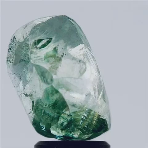 Fancy Intense Greenish Blue Rough Diamond from Vivid Diamonds Inc – a rare and uncut natural diamond with a unique green-blue hue, showcasing its raw beauty and exceptional clarity.